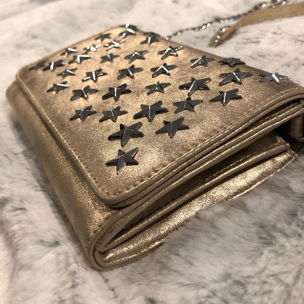 Metallic gold shoulder bag with silver stars